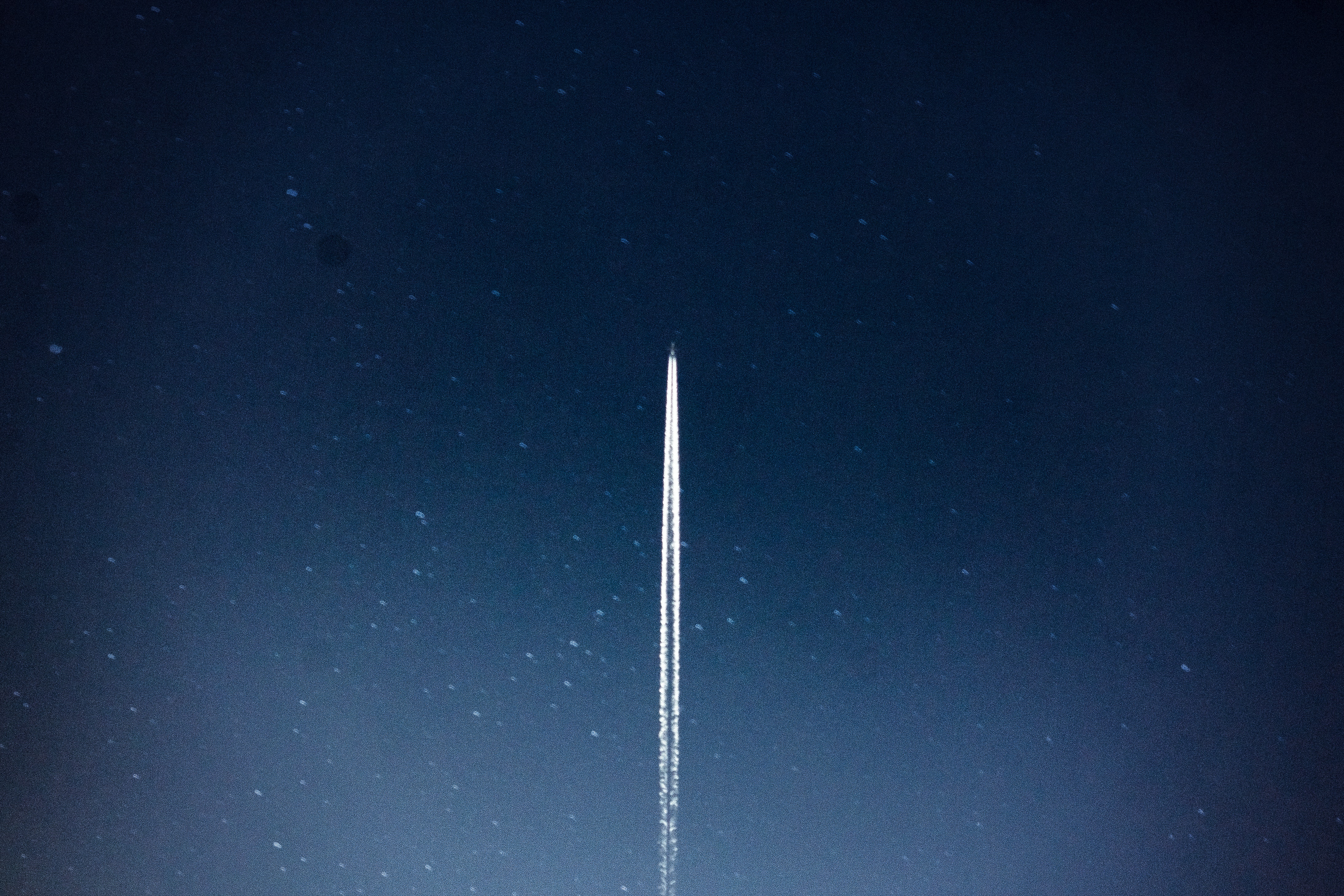A Rocket heading into space at night
